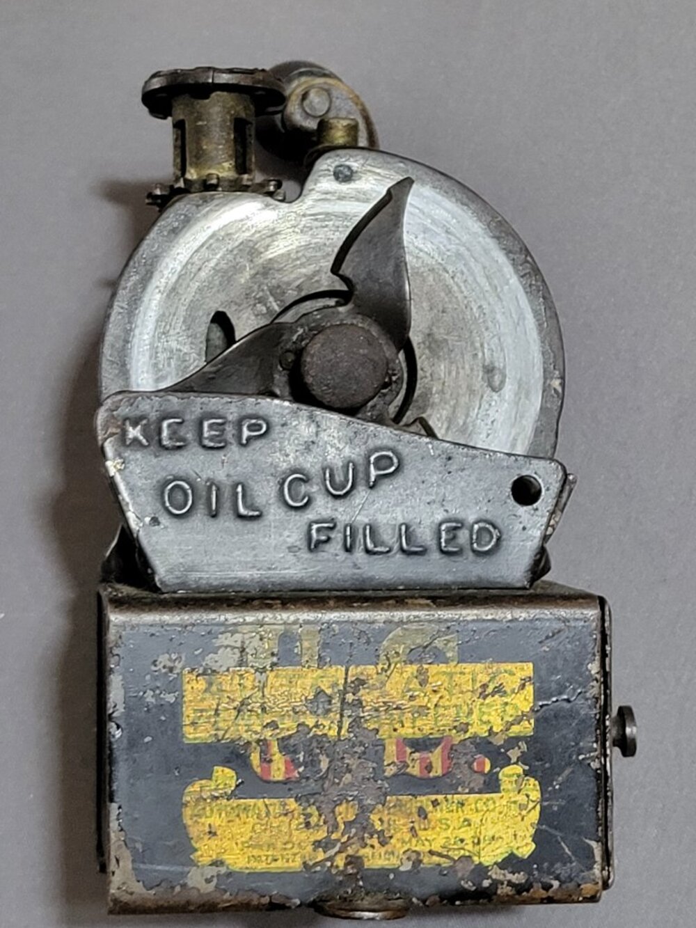 Antique U.S. Automatic Pencil Sharpener made of cast iron and tin.